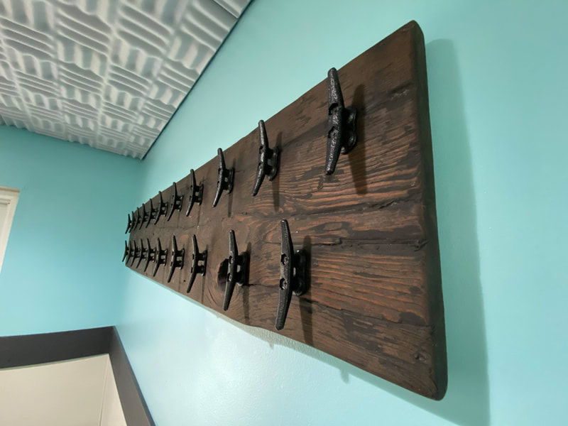 PupsPort Dog Daycare location with hooks for dog leashes in South Philly, Philadelphia.